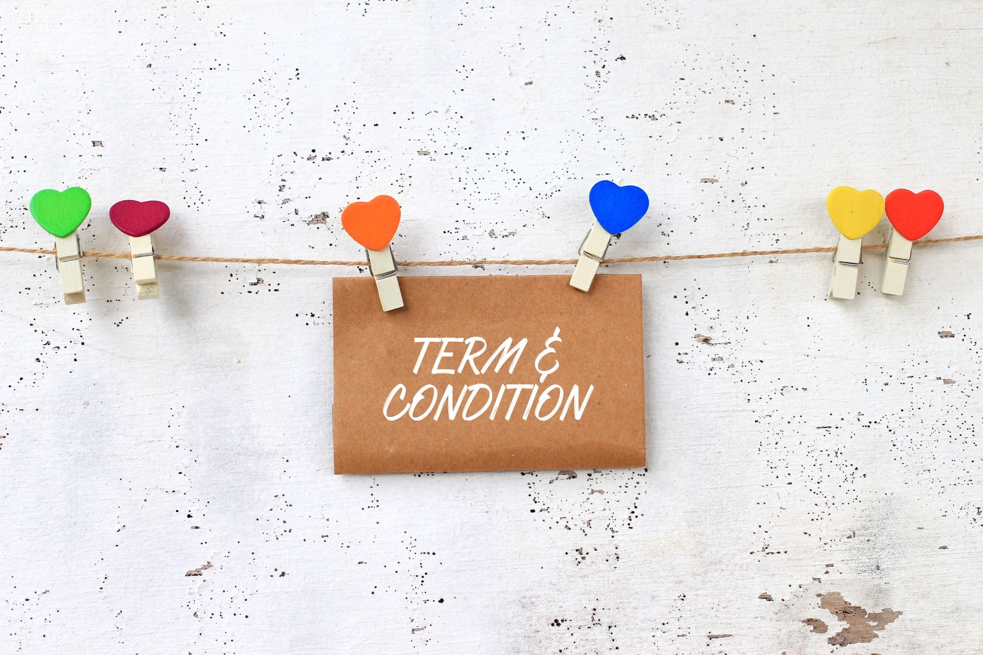 TERM & CONDITION - concept words on paper with wooden clamps. rustic wooden background